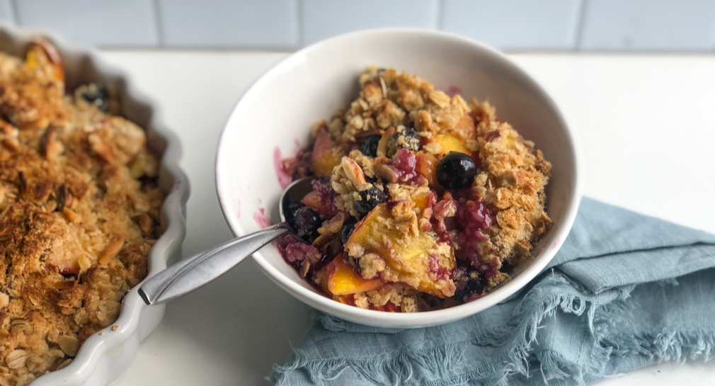 Bowl of blueberry peach crisp