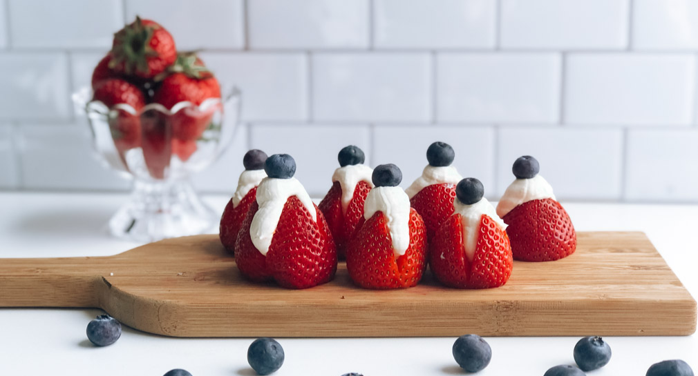 Healthy Cheesecake Stuffed Strawberries topped with blueberries